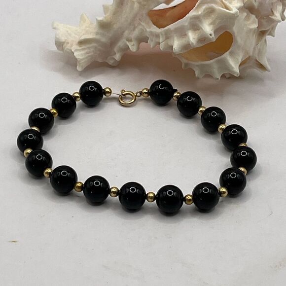 14K gold and Onyx bracelet.
